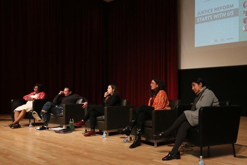 Panel presenting sitting on stage